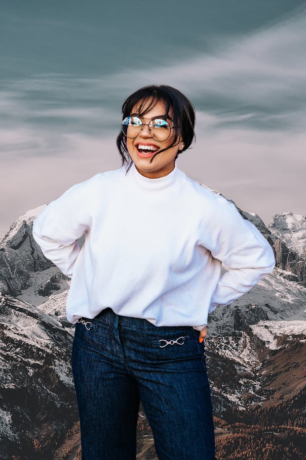 Woman smiling in front of mountains
